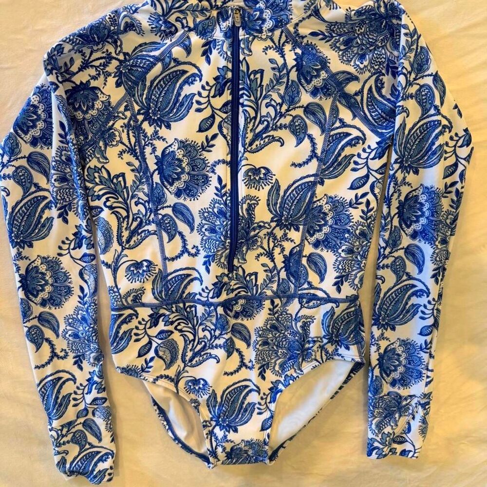 Coolibar girls blue floral long sleeve swimsuit with UPF +50